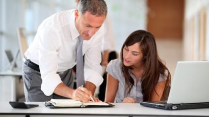 Manager and secretary working in the office.